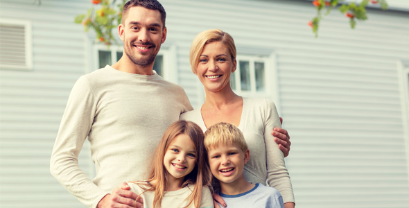 Family in front of home